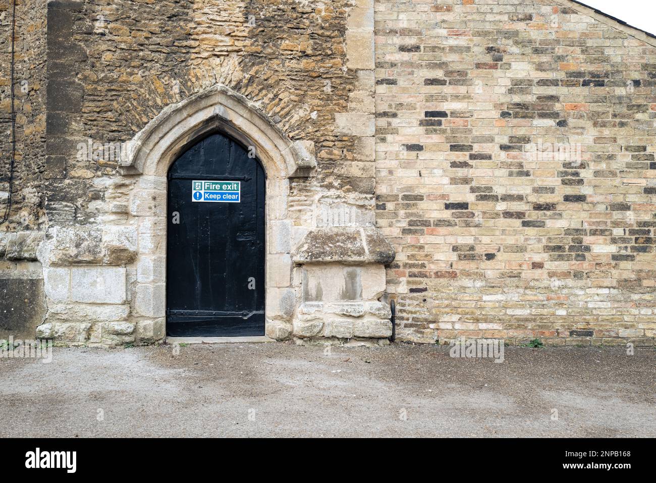 Fire Exit sign seen on an ancient and famous medieval building. Stock Photo