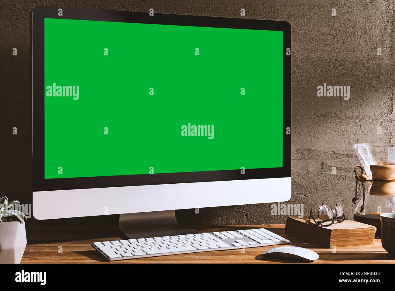 Chroma key green screen, angled view computer on table with a book ...
