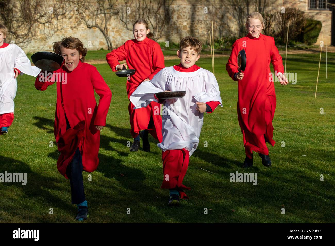 Picture dated February 20th shows Choristers from Ely Cathedral in Cambridgeshire getting some practice in for tomorrows  Shrove Tuesday pancake race Stock Photo