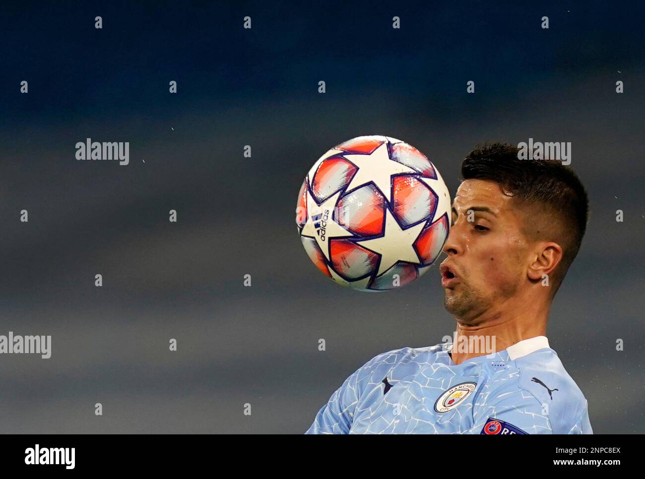 Manchester City's Joao Cancelo heads the ball during the Champions