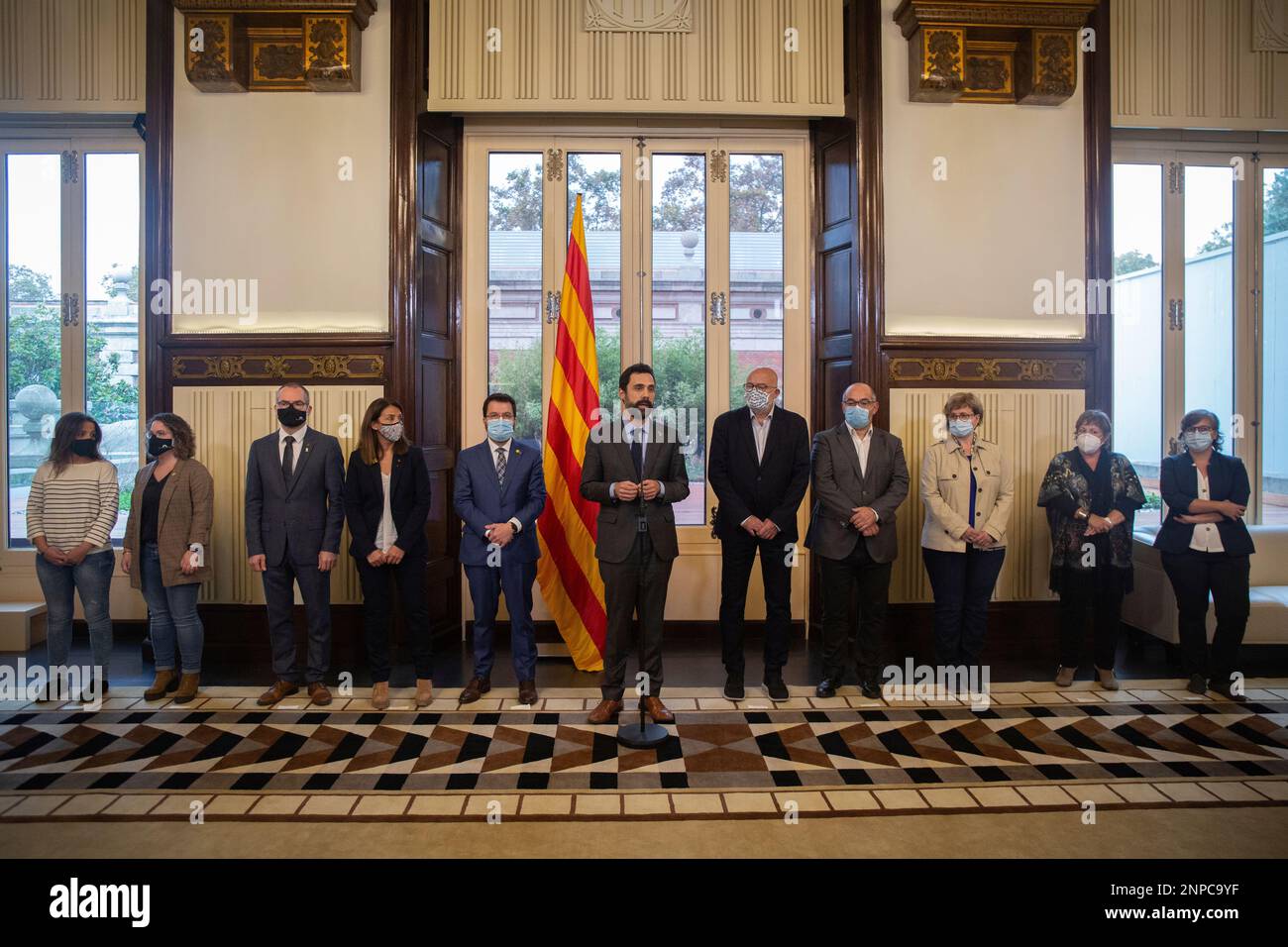 The President of the Parliament, Roger Torrent (c), intervened together  with the Vice President of the Generalitat acting as President, Pere  Aragonès (5l); the Councillor of the Presidency and spokesperson of the