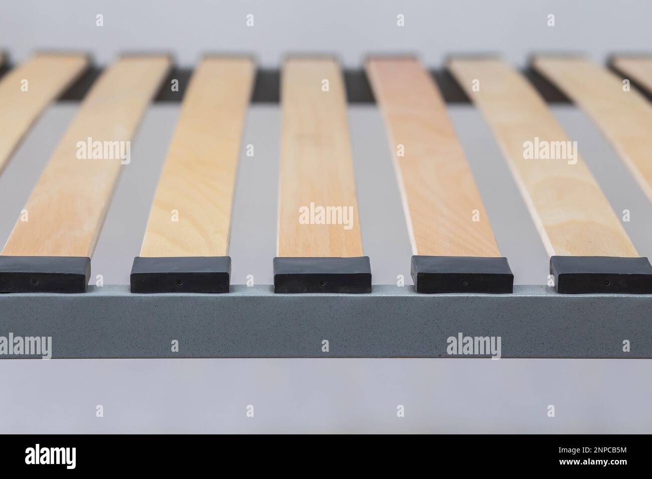 Wooden slats on a metal bed frame close-up Stock Photo