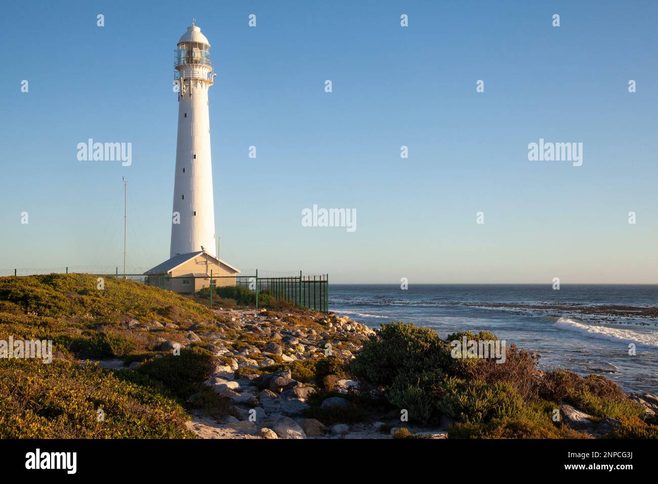Slangkop Lighthouse, Kommetjie, Cape Town, Cape Peninsula, Western Cape, South Africa. Historical cast iron lighthouse or pharos dating to 1914 Stock Photo