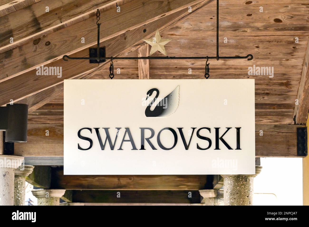San Marcos, Texas - February 2023: Sign outside a factory outlet store for Swarovski Stock Photo