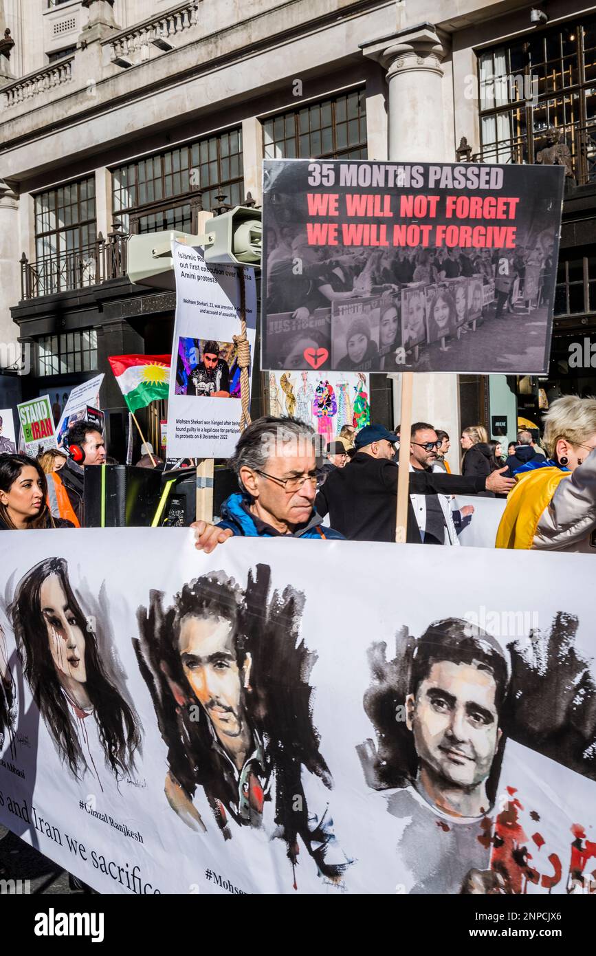 Banner with victims of the Islamic regime, Pro-democracy Iranian protest against the autocratic Islamist government of Iran, central London, UK 25/02/ Stock Photo