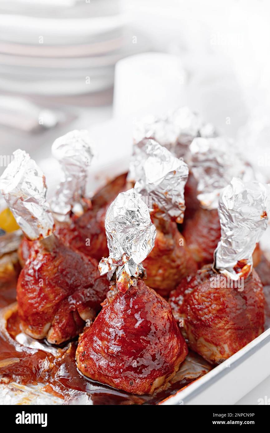 Chicken drumsticks in smoked paprika sauce baked under the grill