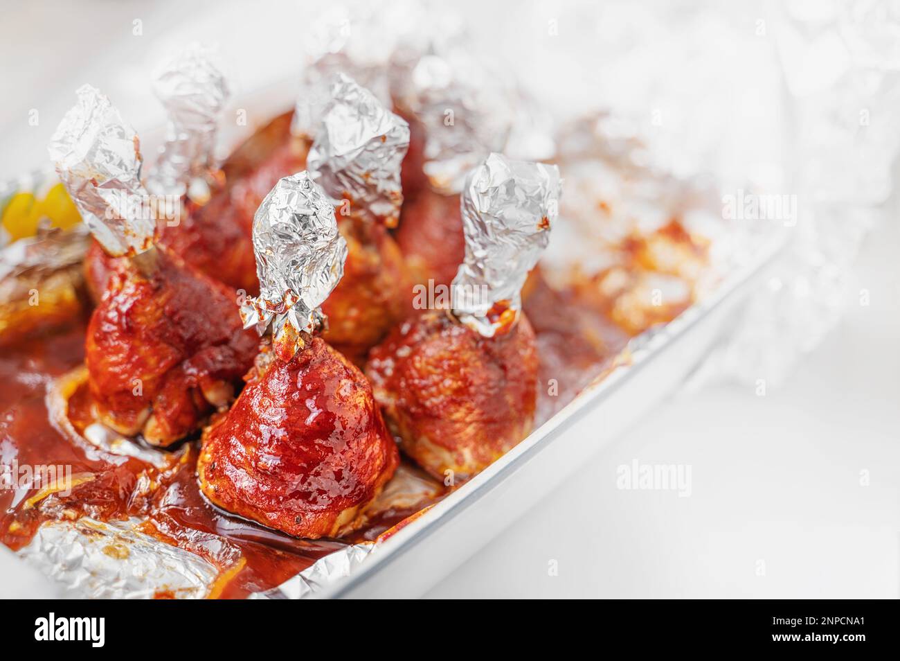 Chicken drumsticks in smoked paprika sauce baked under the grill