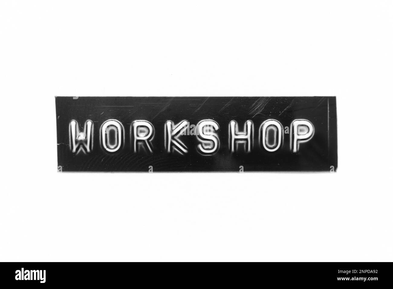 Black color banner that have embossed letter with word on