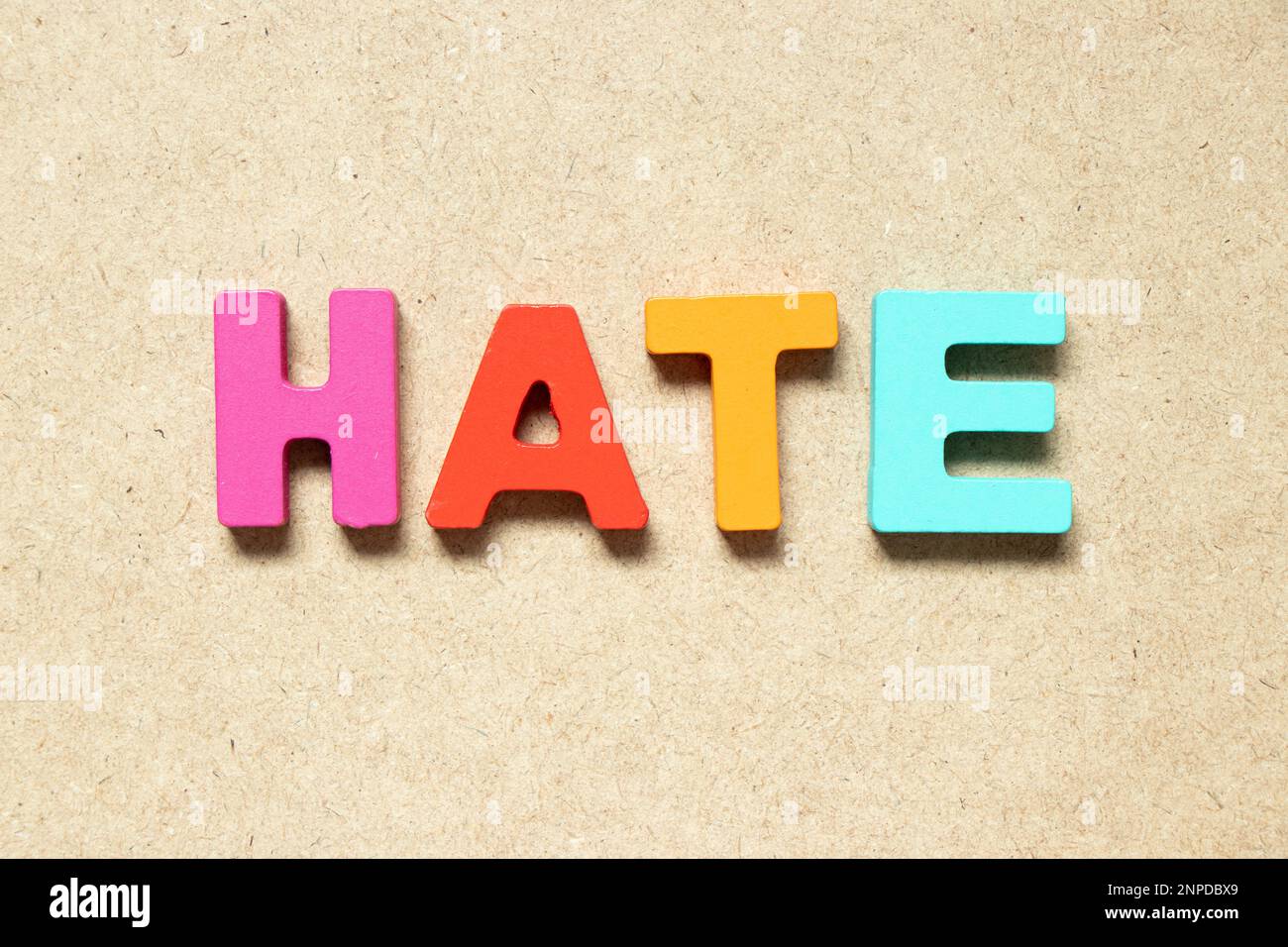 Color alphabet letter in word hate on wood background Stock Photo Alamy