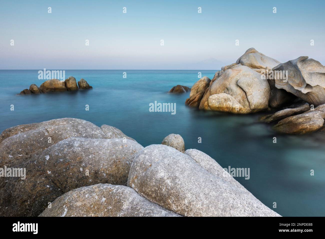 The beautiful shapes and sculptures of rock at dusk near Kavourotrypes Beach in Sithonia. Stock Photo