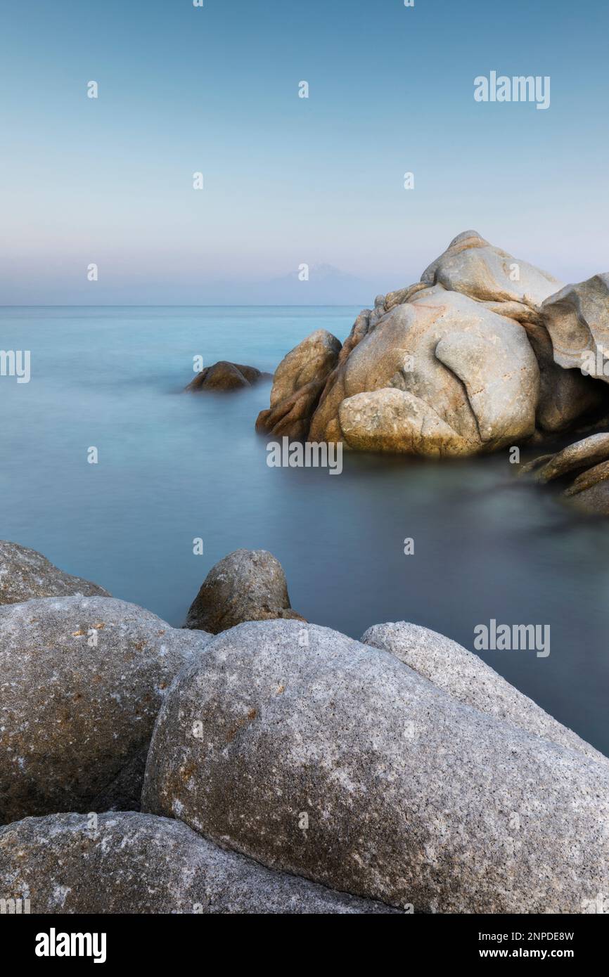 The beautiful shapes and sculptures of rock at dusk near Kavourotrypes Beach in Sithonia. Stock Photo