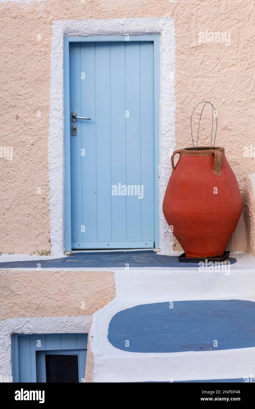 A abstract view of the colourful architecture with a red urn in Oia in Santorini. Stock Photo