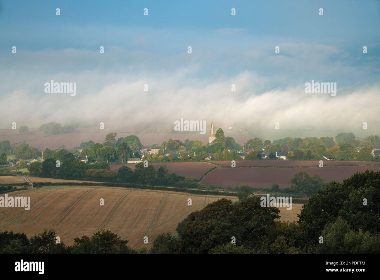 Morning mist over the village of Trellech in Wales. Stock Photo