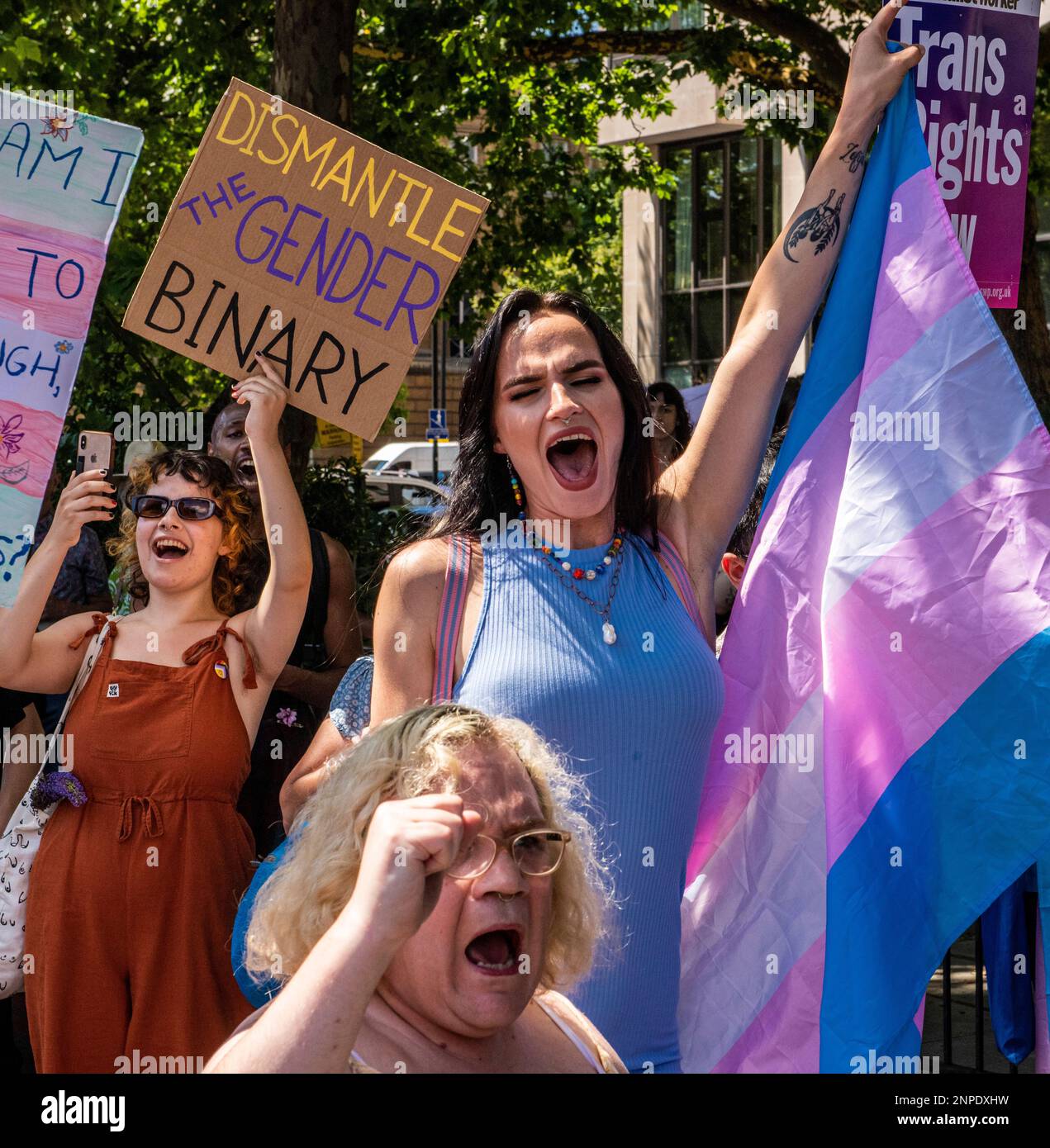 Members of the LGBTQ+ community shout slogans at the top of their voices and hold banners as they protest against the lack of rights and healthcare fo Stock Photo