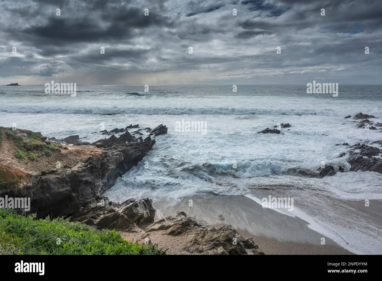 Gathering clouds over Fistral Bay in Newquay in Cornwall in the UK. Stock Photo