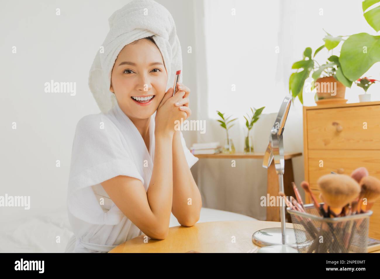 Asian woman make-up with brushes Stock Photo