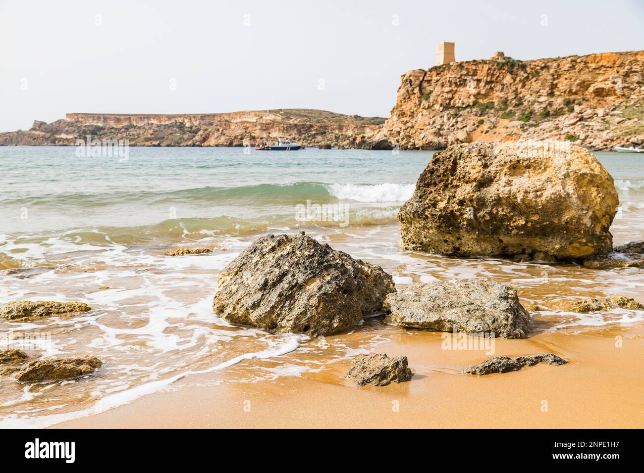 Rocks on the orange beach of Ghajn Tuffieha in the North West of Malta. Stock Photo