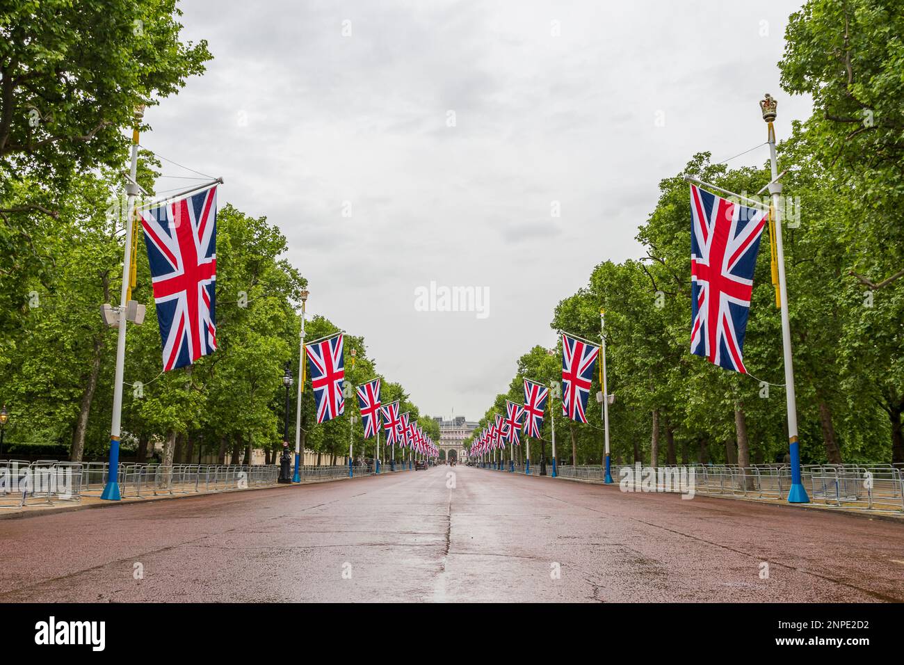 Looking up The Mall towards Admiralty Arch during preparations for the Queens Platinum Jubilee celebrations, lined with Union Jack flags. Stock Photo