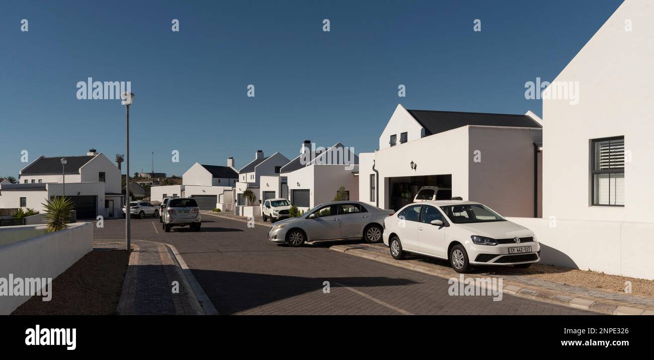Langebaan, West Coast, South Africa. 2023. New build homes and vehicles parked in the street in Langebaan. Stock Photo