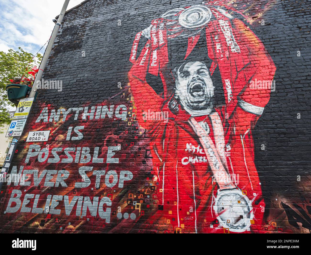 A vivid mural of Liverpool FC captain Jordan Henderson lifting the Premier League trophy in the 2019-20 season. Stock Photo