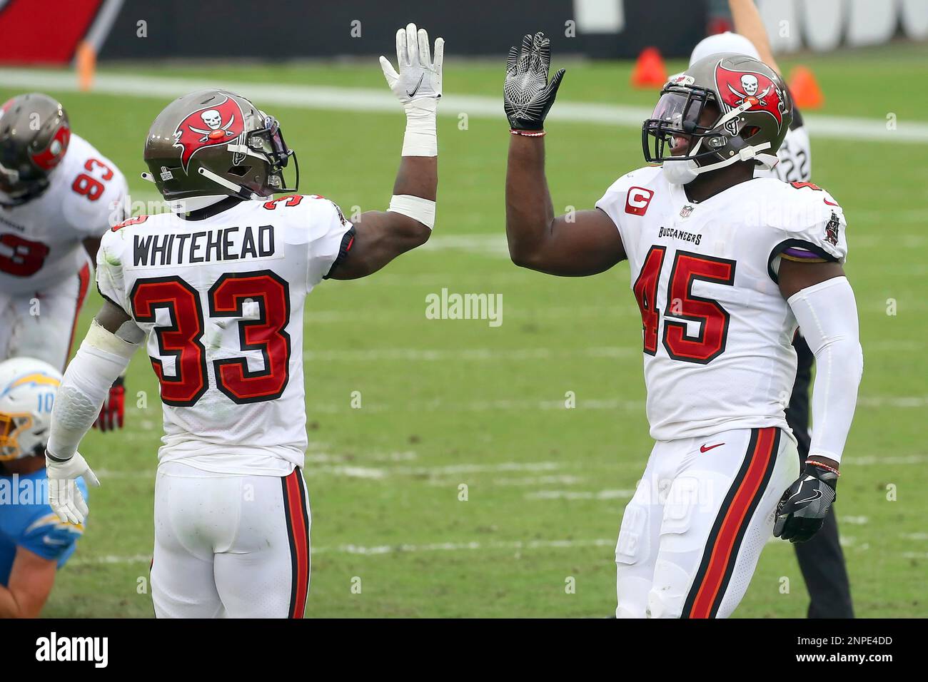 TAMPA, FL - OCTOBER 04: Jordan Whitehead (33) and Devin White (45) of the  Buccaneers celebrates a defensive stop during the regular season game  between the Los Angeles Chargers and the Tampa