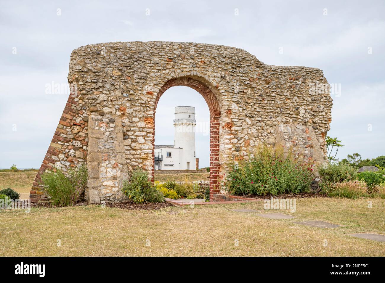 The ruins of St Edmunds Chapel frames the lighthouse at Hunstanton on the West Norfolk coast. Stock Photo