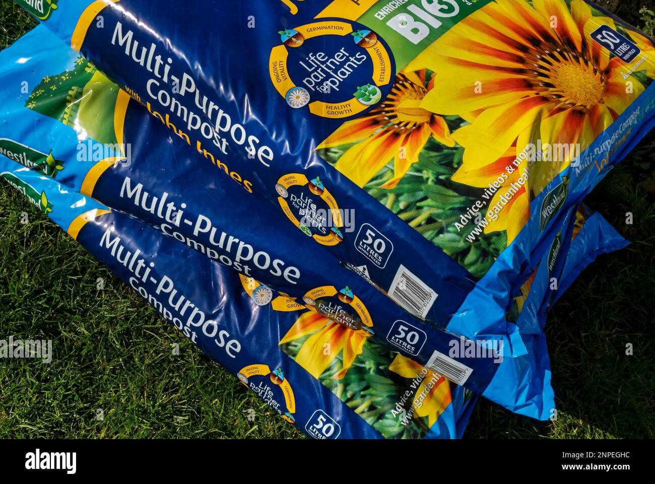 Close up of bags of multi purpose potting compost with John Innes Stock
