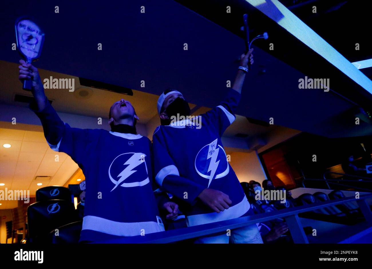 Tampa Bay Lightning fans Carson Cain, 13, and Cooper Hollis, 13, cheer