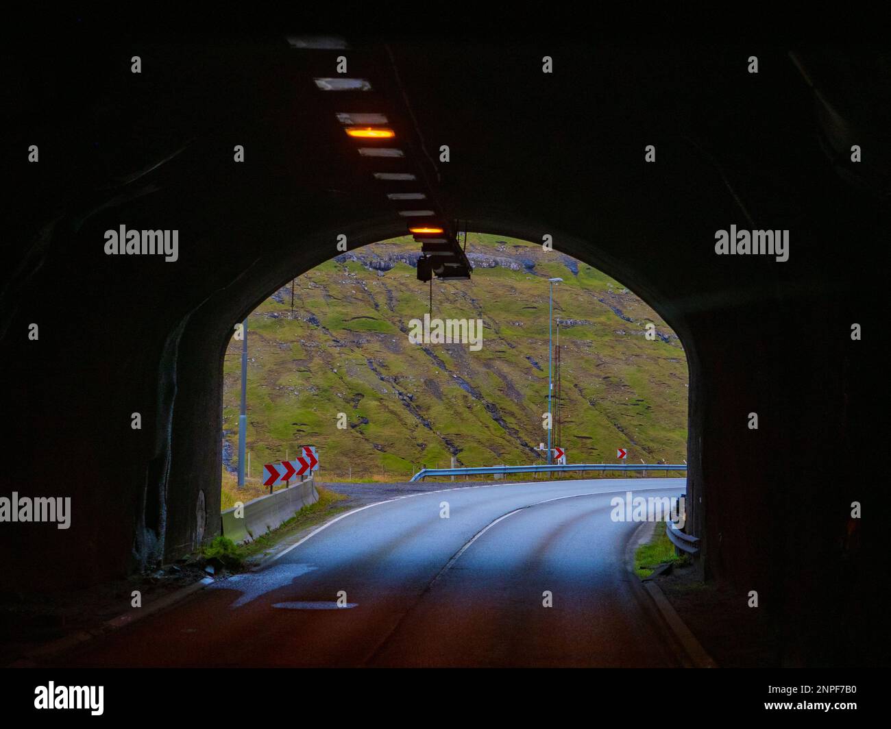 Tunnel via the mountains in the Faroe Islands. Tunnels and bridges are