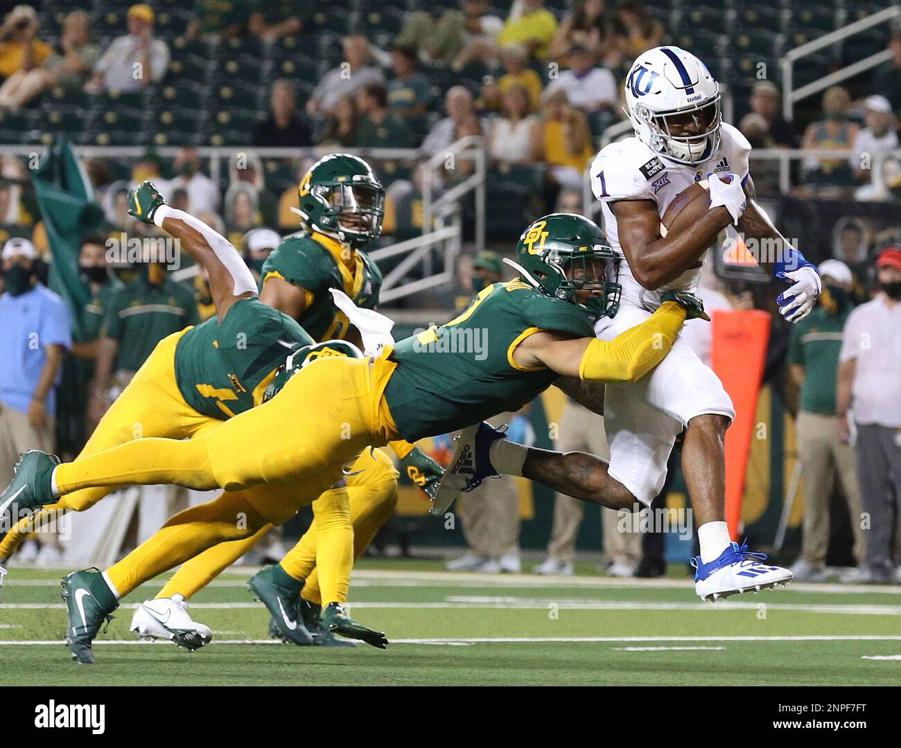 Kansas running back Pooka Williams Jr. (1) scores a touch down past