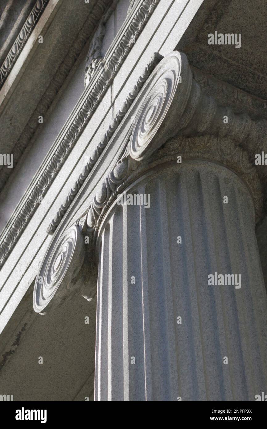 A tall Greek column with a fluted trunk and a scroll capital Stock Photo Alamy