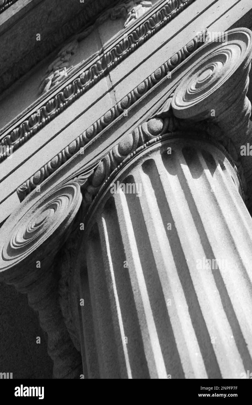 A tall Greek column with a fluted trunk and a scroll capital Stock Photo Alamy