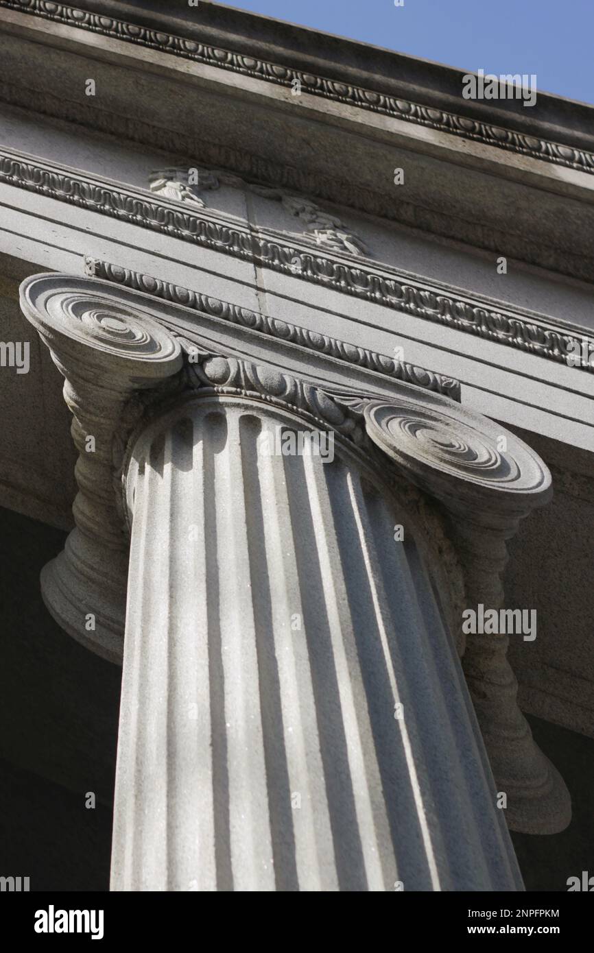 A tall Greek column with a fluted trunk and a scroll capital Stock Photo Alamy