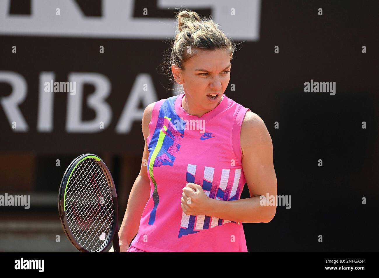 Simona Halep celebrates after winning a point to Yulia Putintseva during their quarterfinal match at the Italian Open tennis tournament, in Rome, Saturday, Sept