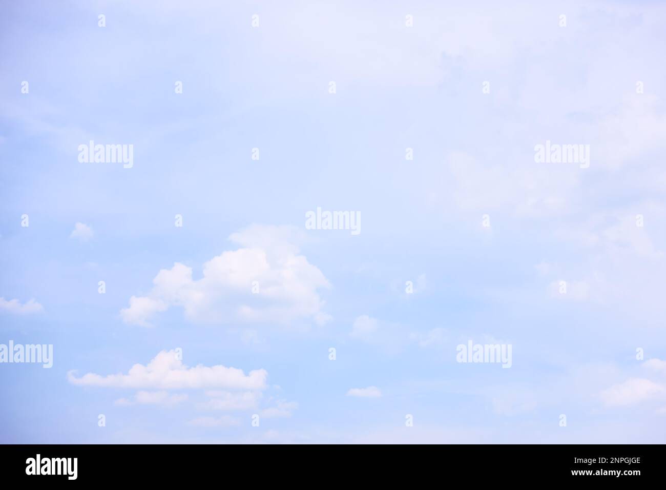 Background with bright blue sky and light clouds Stock Photo