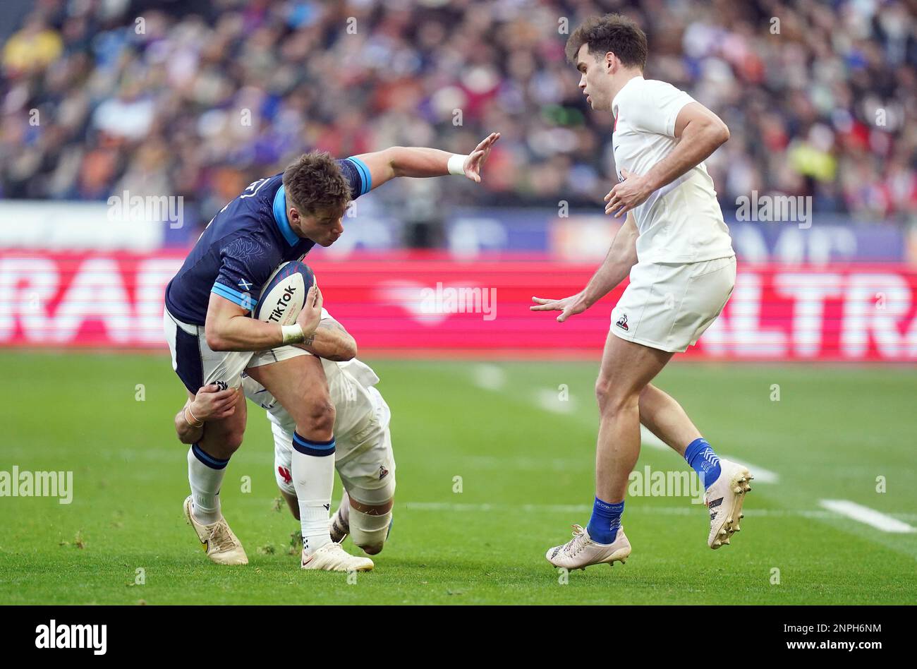 France's Romain Ntamack tackles Scotland's Huw Jones during the