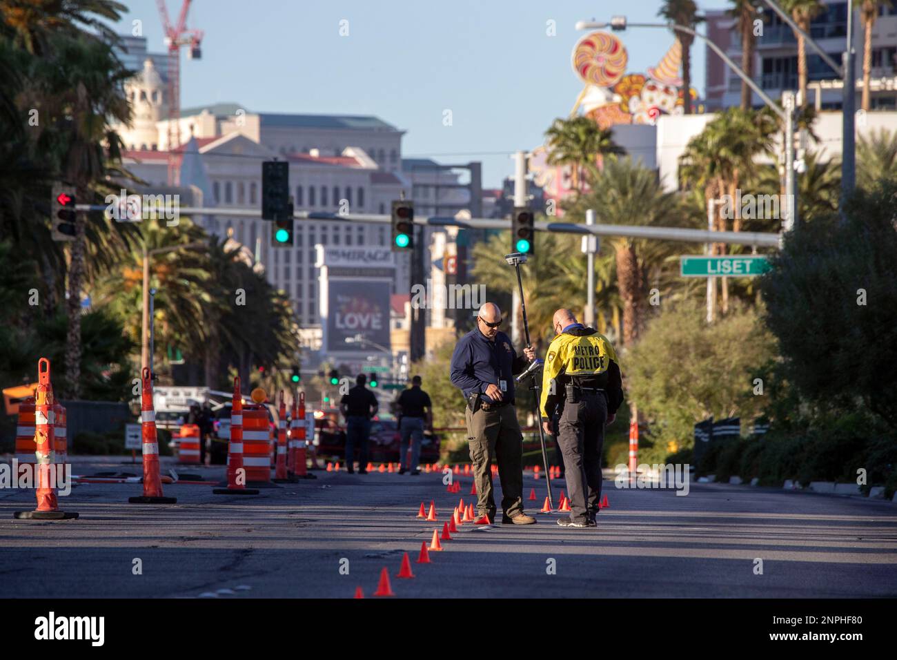 Las Vegas Metro Police take measurements as they investigate a fatal ...