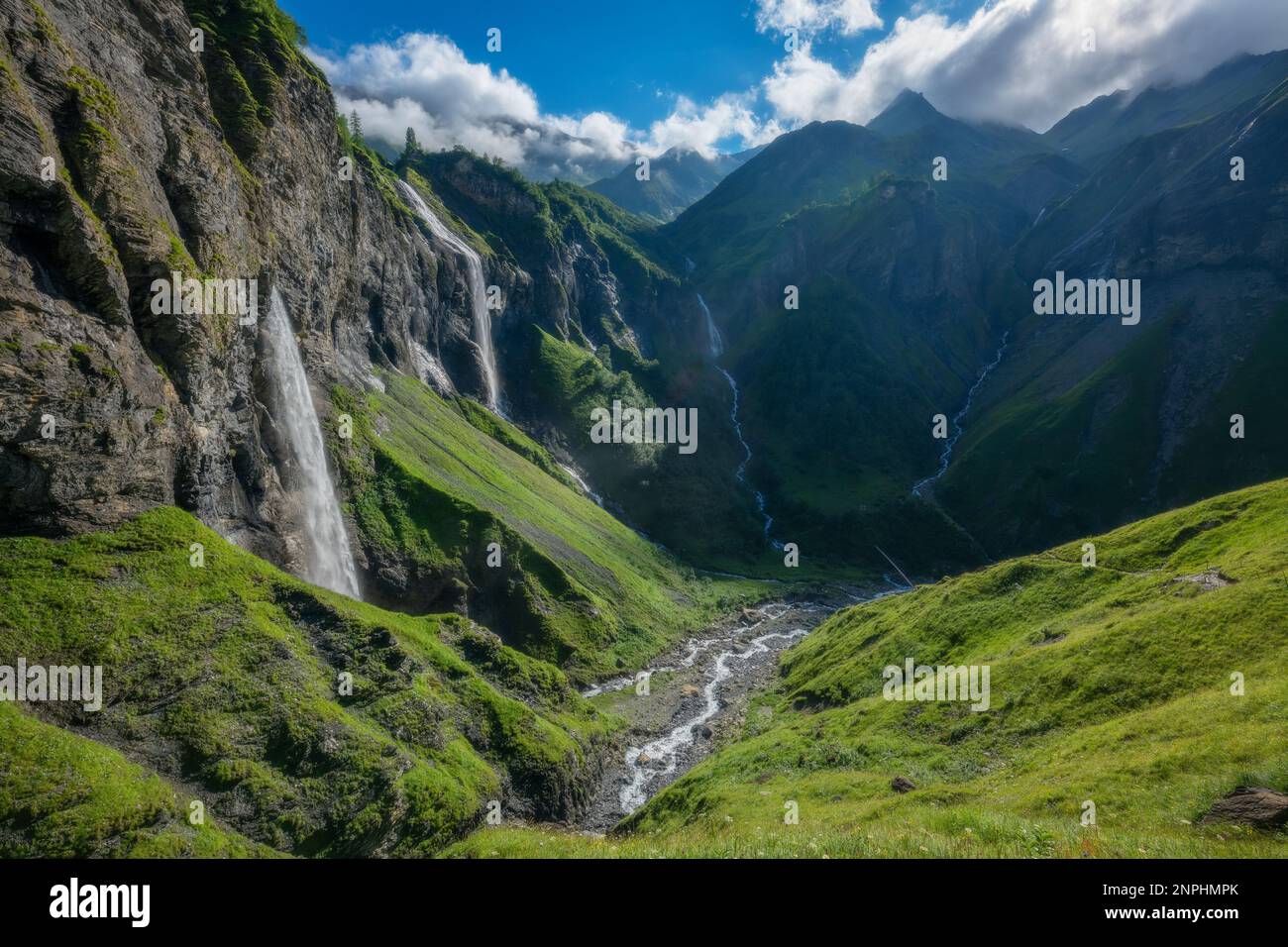 several large waterfalls falling down a steep cliff Stock Photo - Alamy
