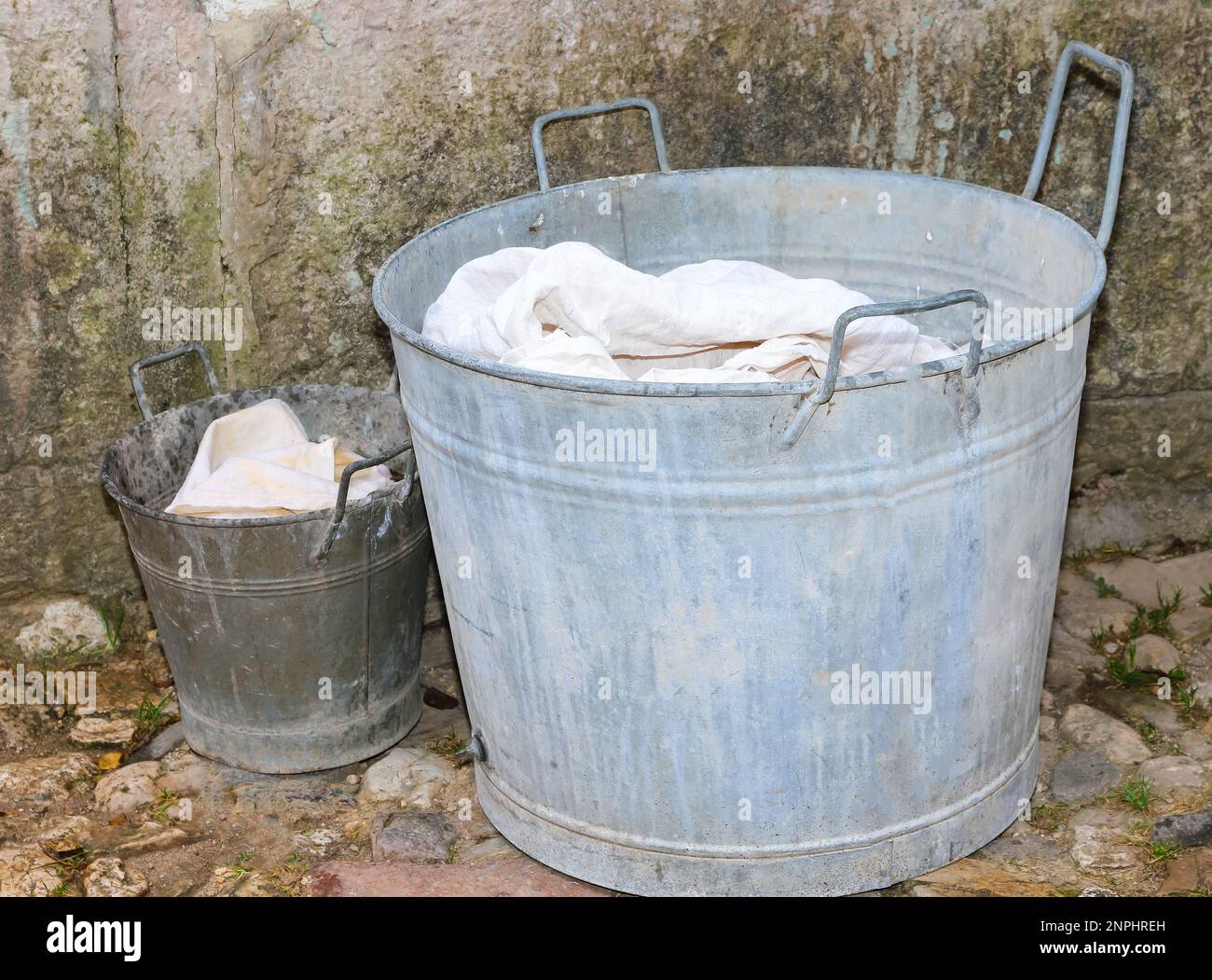 old tin tub and small metal bucket for doing the laundry during the