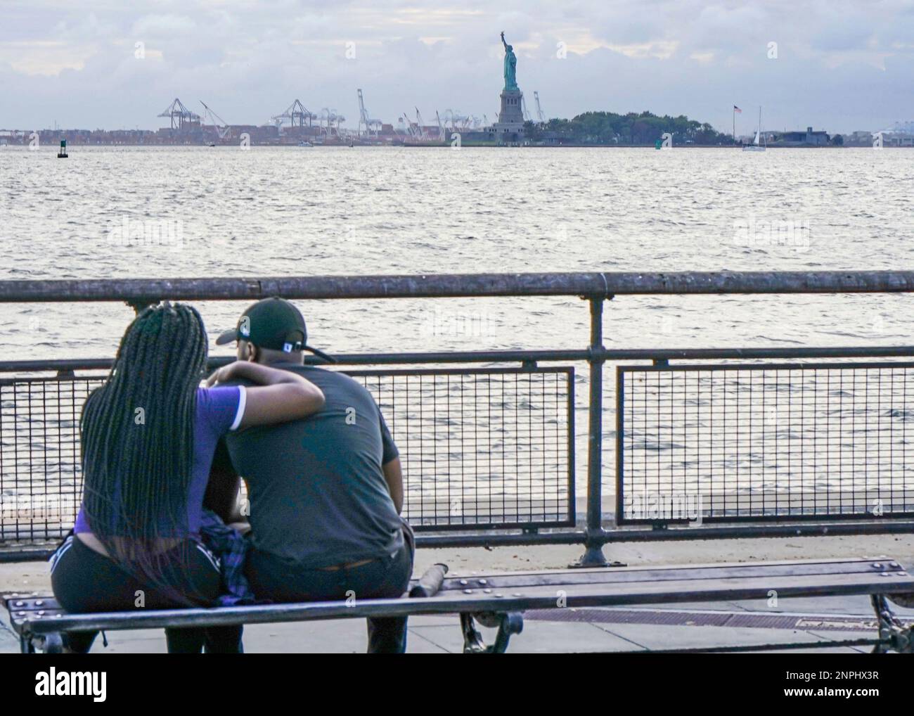 A couple enjoys the view of the Statue of Liberty from the Battery Park.New  York City is preparing to move into Phase 4 of re-opening following  restrictions imposed to curb the coronavirus
