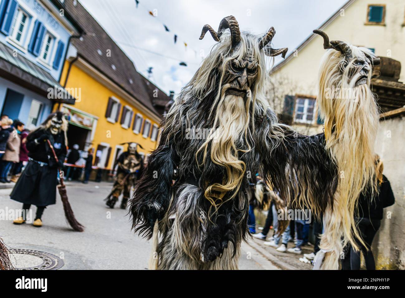 Sulzburg, Germany. 26th Feb, 2023. Members of the "Wolfsblutteufel Oberes  Bregtal" walk through Sulzburg during a carnival procession. A few days  after the official end of the normal carnival on Ash Wednesday,