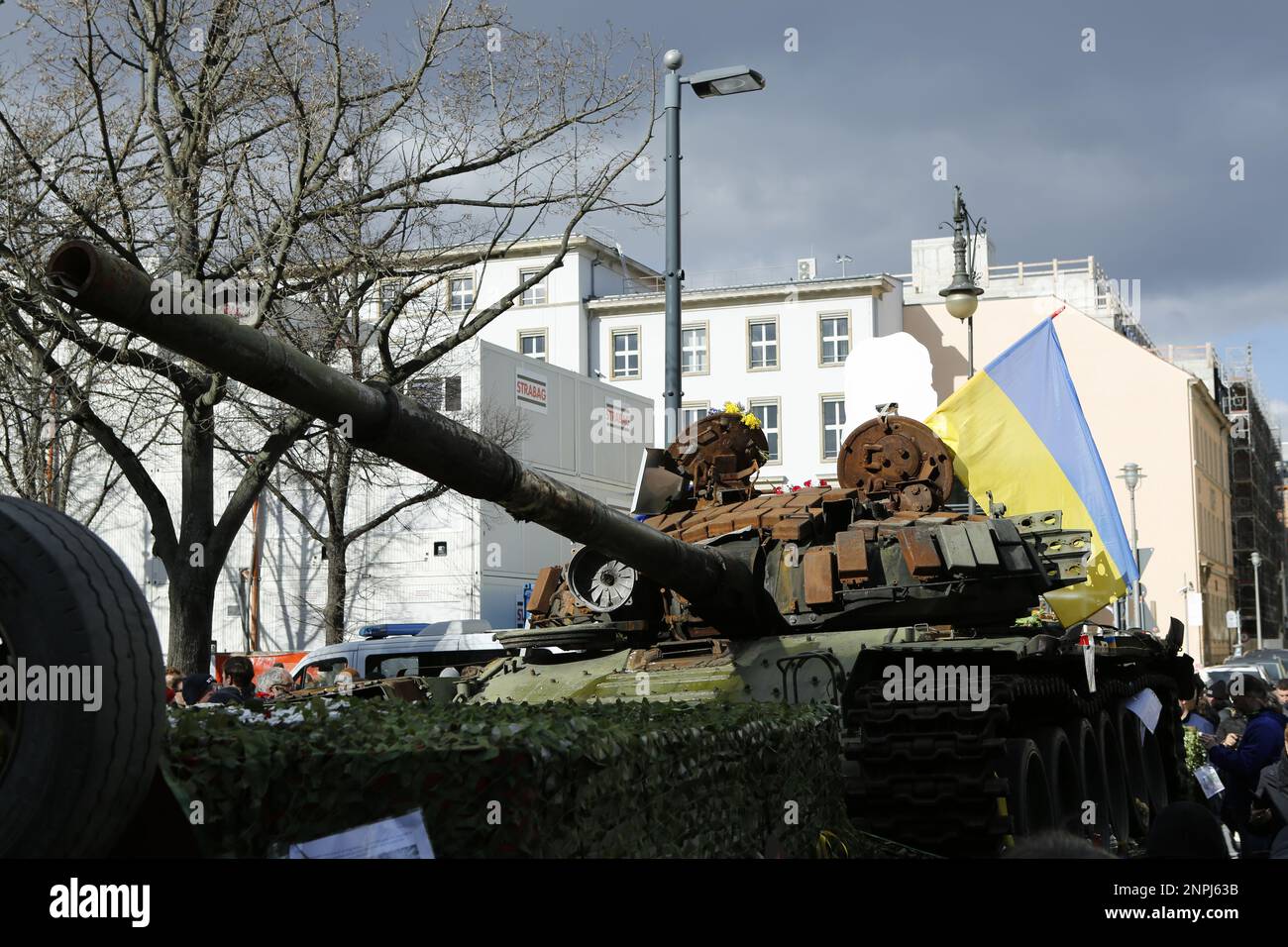Germany, Berlin, 02/26/2023. A wrecked tank has stood in front of the Russian embassy in Berlin-Mitte since the anniversary of the Russian attack on Ukraine. The destroyed T-72 tank in front of the Unter Den Linden building as a memorial against the war. Stock Photo