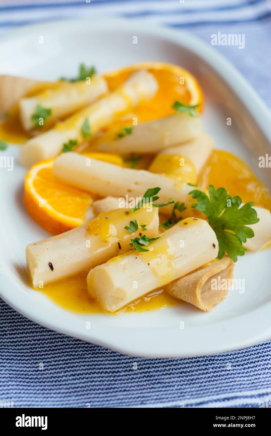 Salsify with Vegan Lunch meat and Orange Sauce Stock Photo