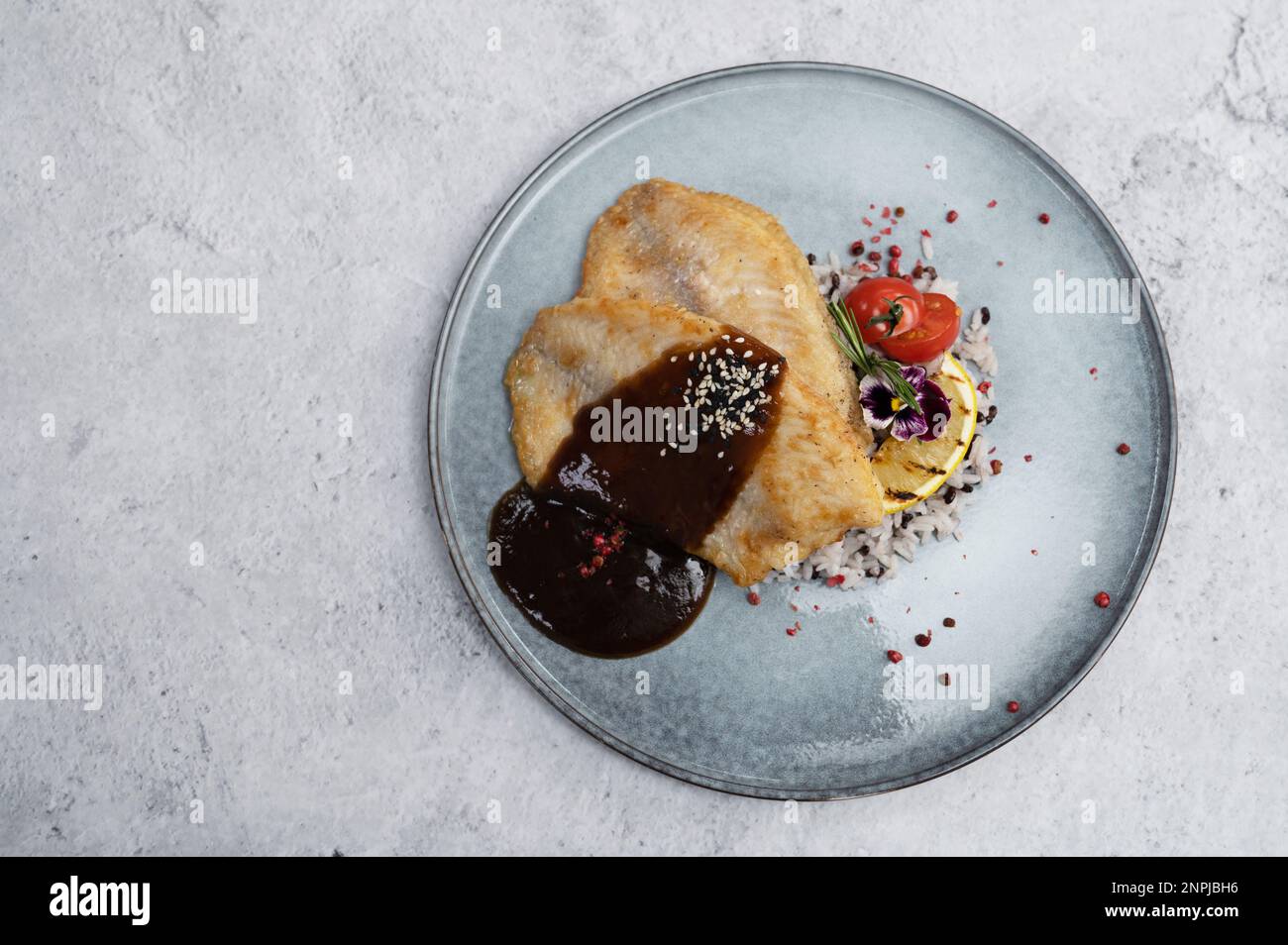Fried tilapia fish with rice sauce and vegetable Stock Photo Alamy