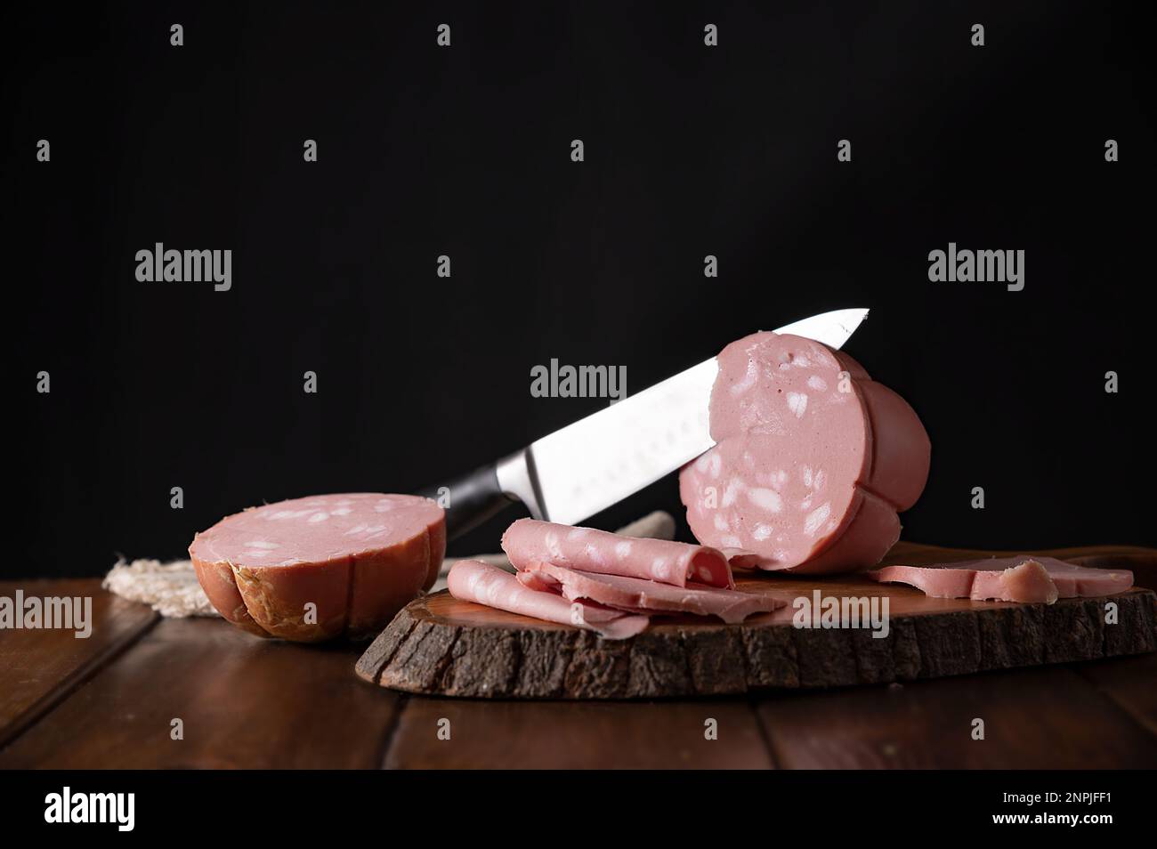 Mortadella. Traditional pork sausage with pistachios or black pepper