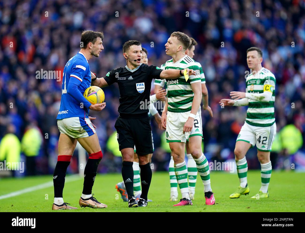 Referee Nick Walsh intervenes as Rangers' Borna Barisic and Celtic's