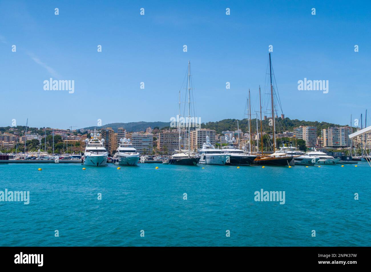PALMA, SPAIN - 20TH MAY 22: A harbour in Palma Spain. Showing boats and apartment buildings Stock Photo