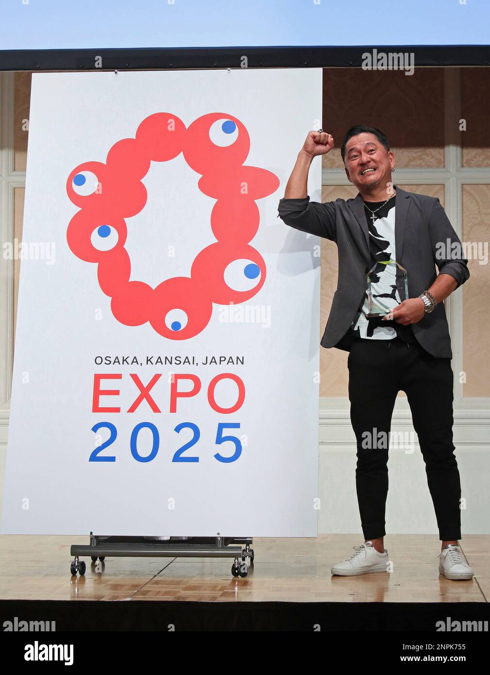 A graphic designer Tamotsu Shimada of TEAM IARI poses for photo after