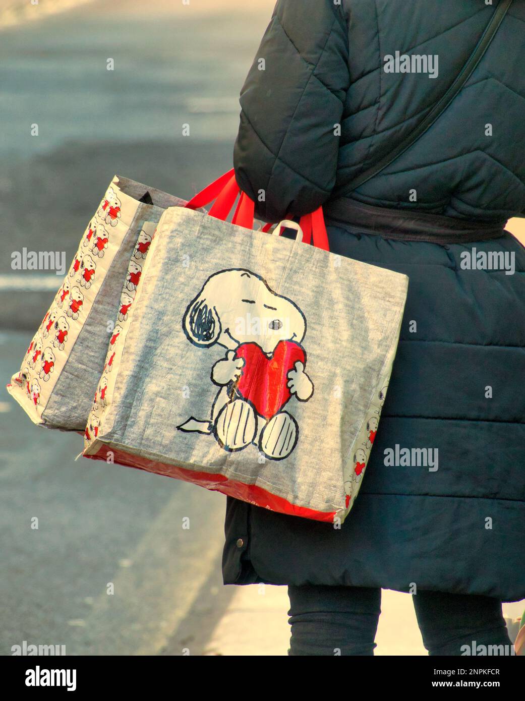 Glasgow, Scotland, UK  26th February, 2023. UK Weather:  Snoopy and love. Sunny day and the spring like weather saw people take to the streets as life returned to the city centre after winter. Credit Gerard Ferry/Alamy Live News Stock Photo