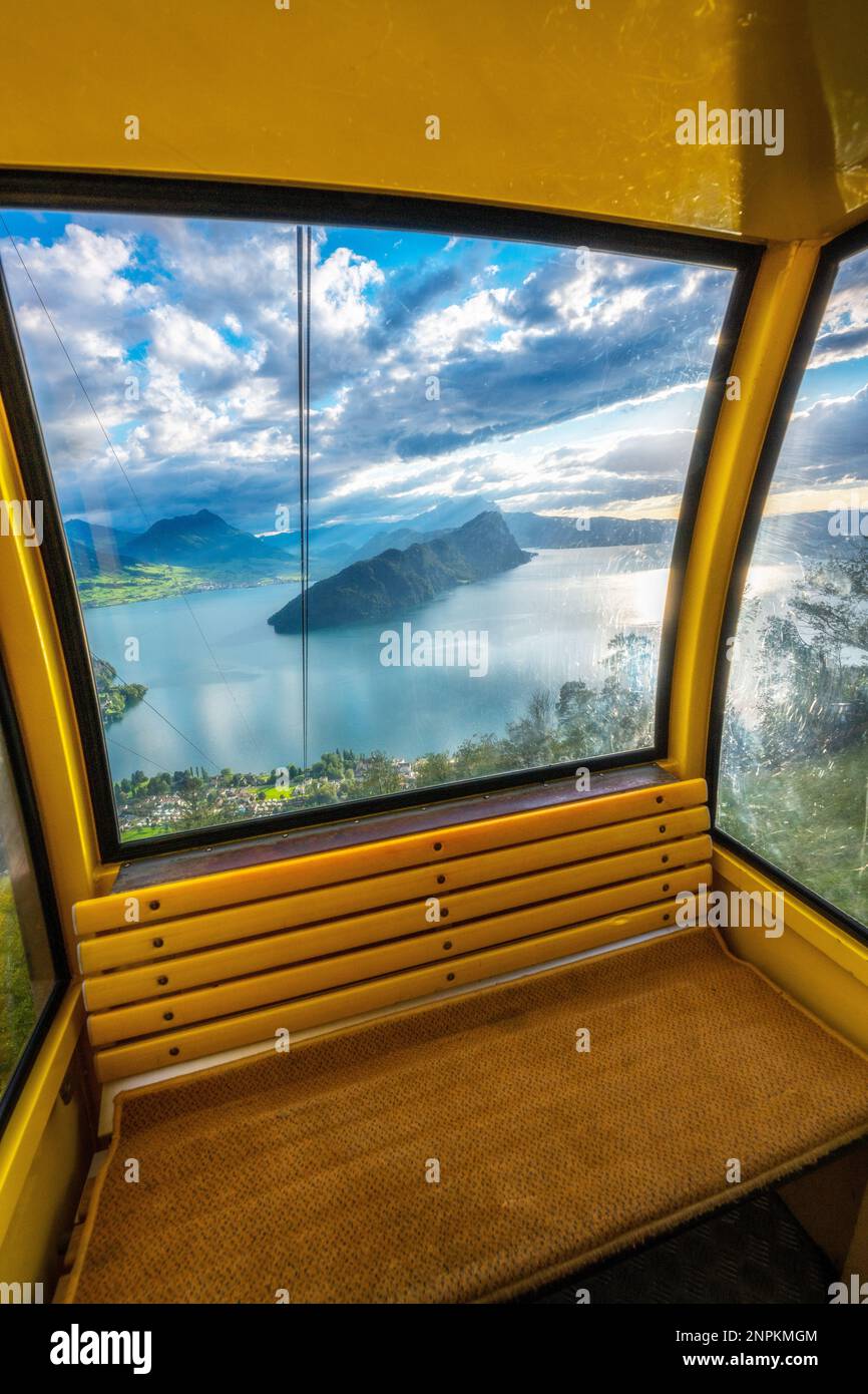 A cable car photographed from inside, from the window view you see a ...